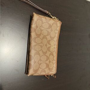 Coach Brown Clutch with Monogram Pattern and Zipper Closure